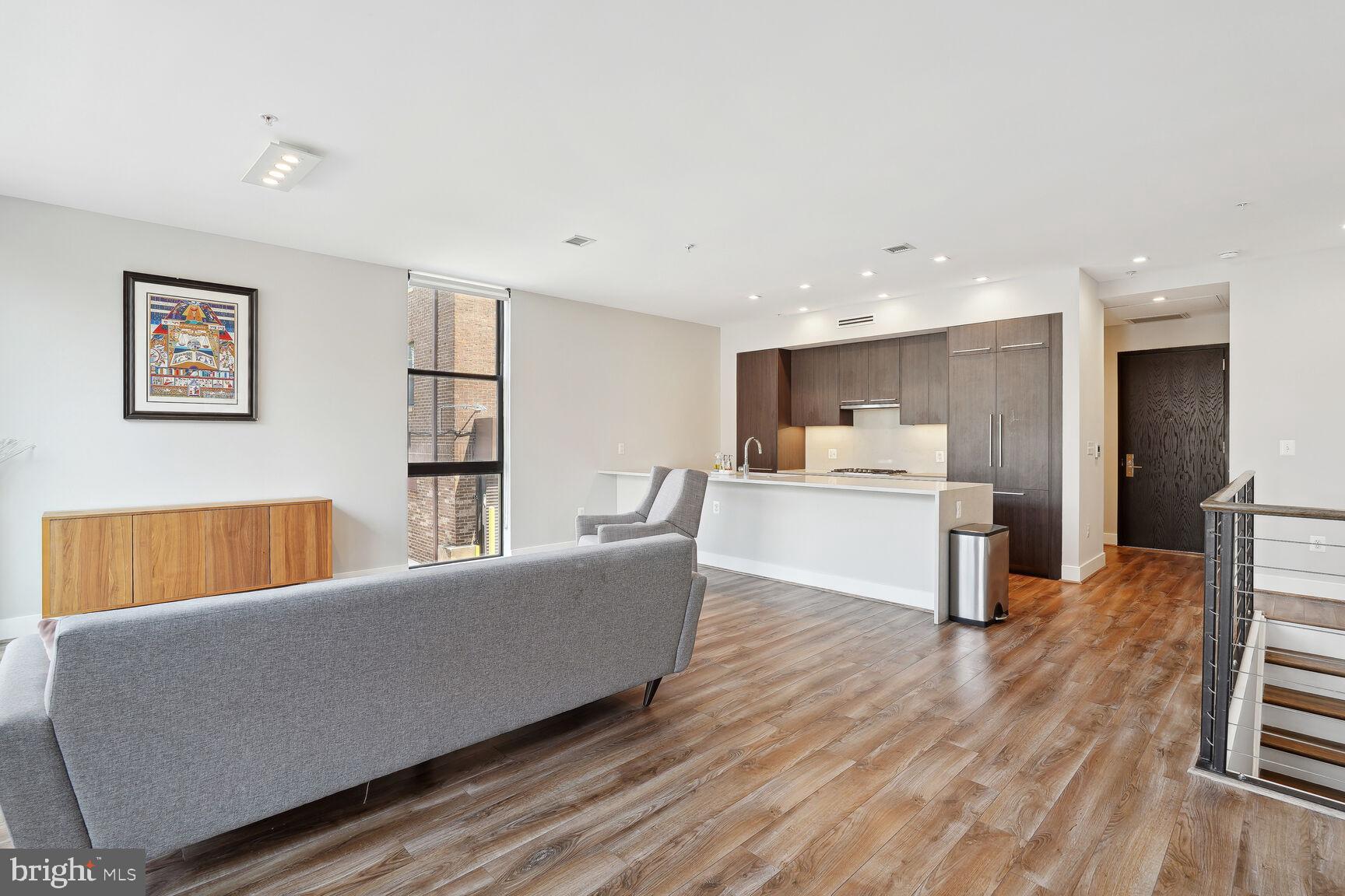 1628 11th Street Northwest, Unit 108 Washington, DC 20001 - Photo 7 of 44 a living room with furniture and kitchen view