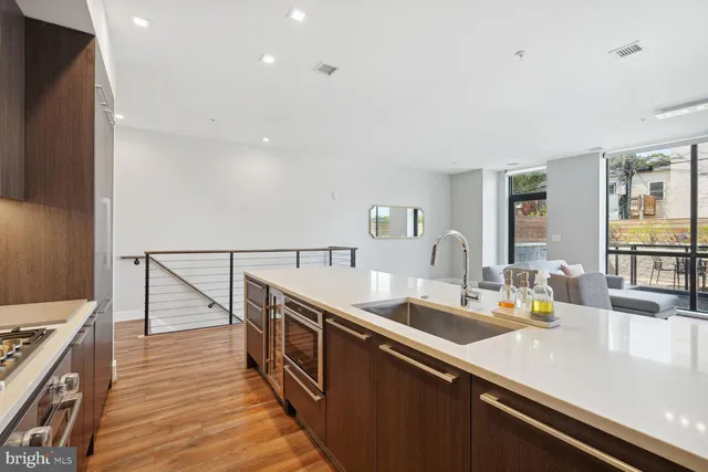 a room with counter space and wooden floor