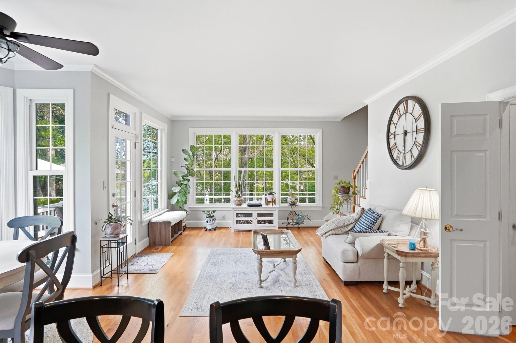 11078 Deep Cove Drive Tega Cay, SC 29708 - Photo 12 of 46 a living room with furniture a large window and a table