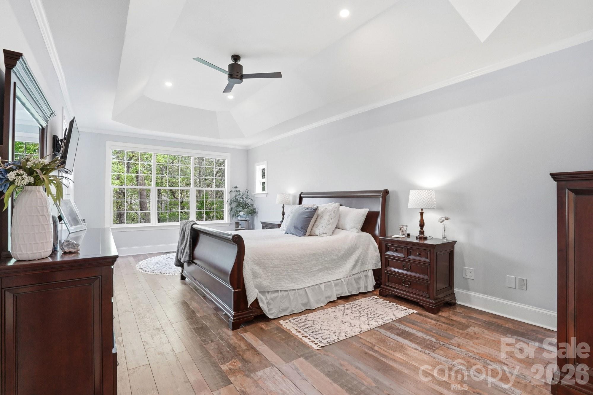 11078 Deep Cove Drive Tega Cay, SC 29708 - Photo 20 of 46 a spacious bedroom with a bed and glass window