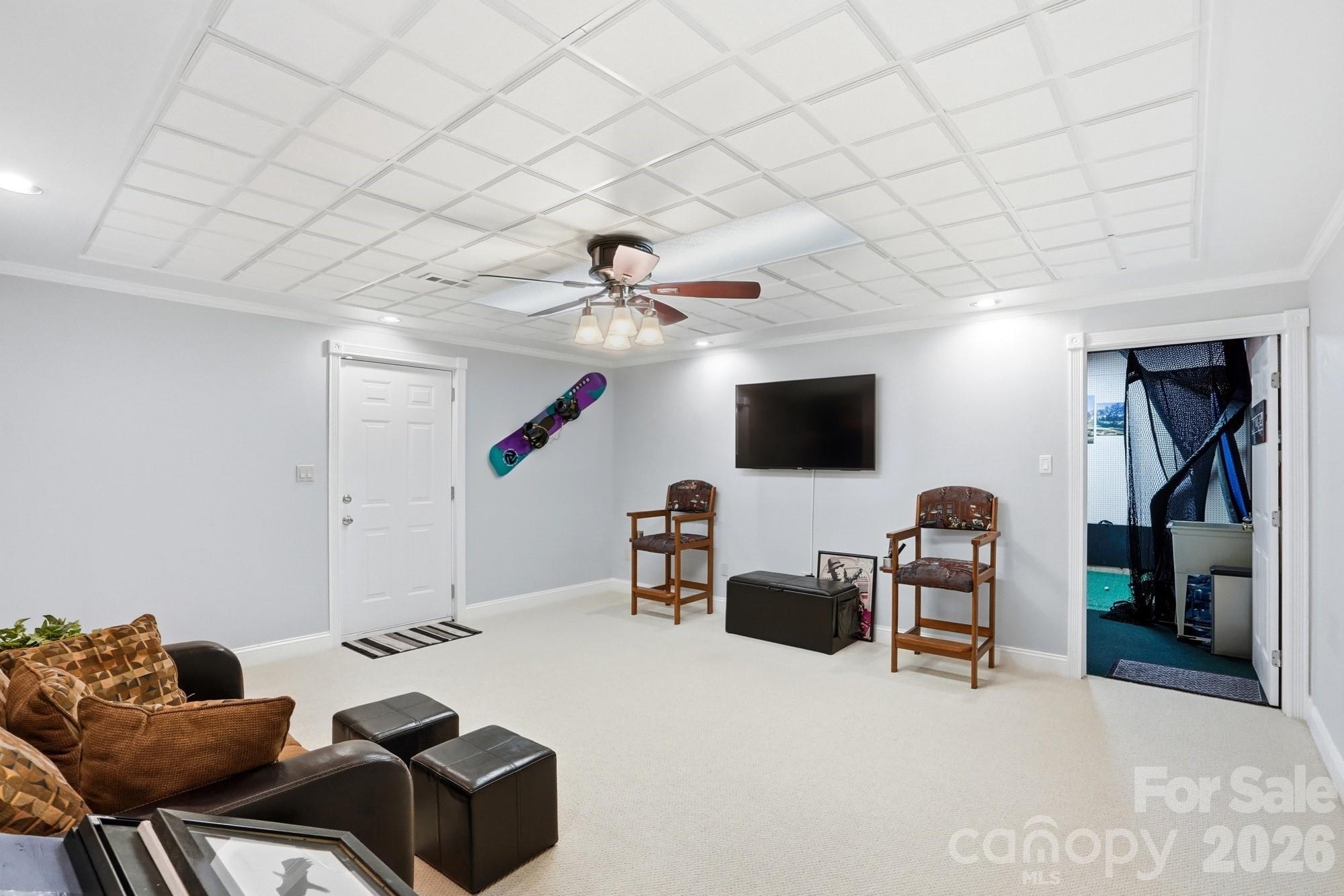 11078 Deep Cove Drive Tega Cay, SC 29708 - Photo 31 of 46 a living room with furniture and a flat screen tv