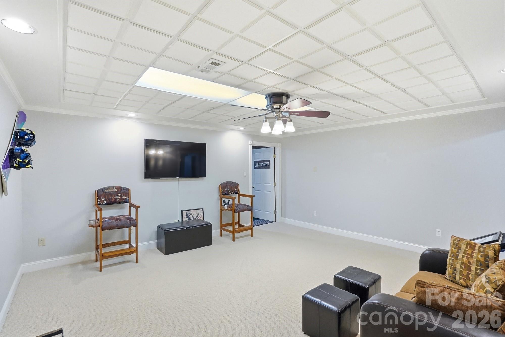 11078 Deep Cove Drive Tega Cay, SC 29708 - Photo 32 of 46 a living room with furniture and a flat screen tv