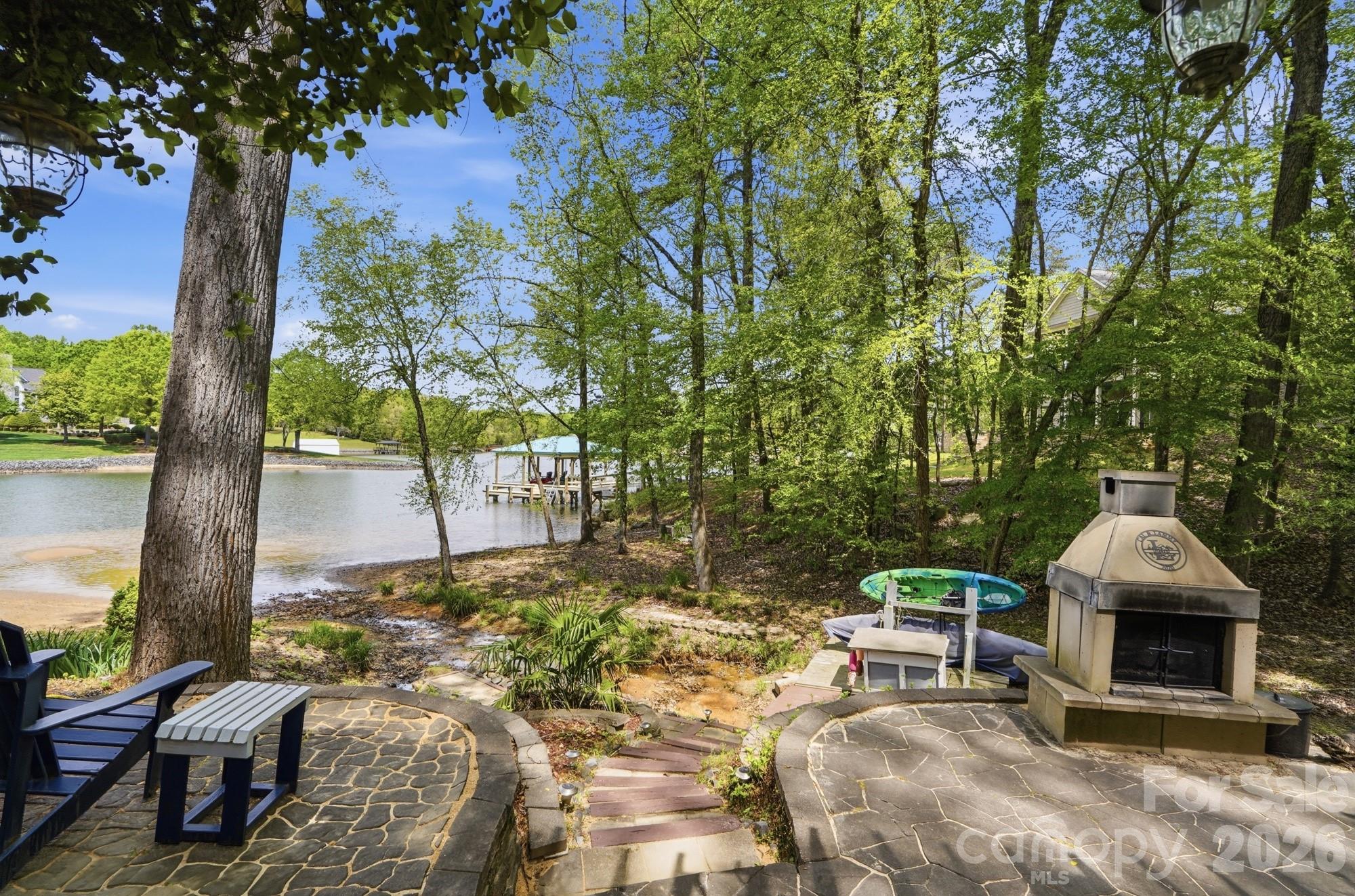 11078 Deep Cove Drive Tega Cay, SC 29708 - Photo 45 of 46 a view of a patio with table and chairs and potted plants