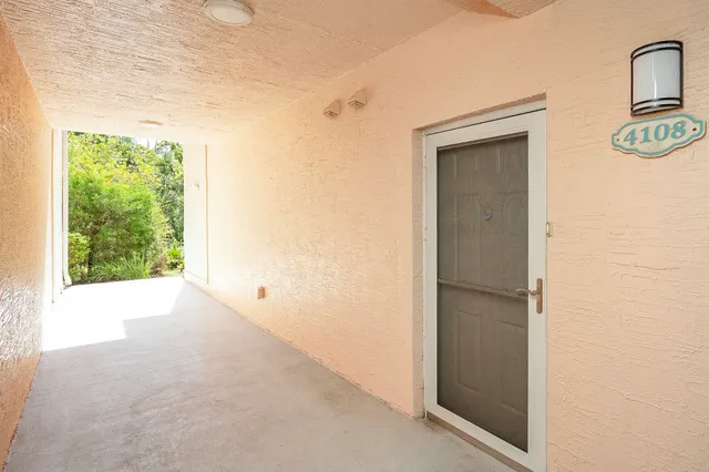 a living room with furniture and a flat screen tv with wooden floor