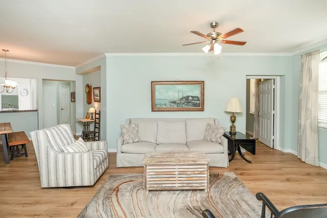 a view of a livingroom with furniture and a window