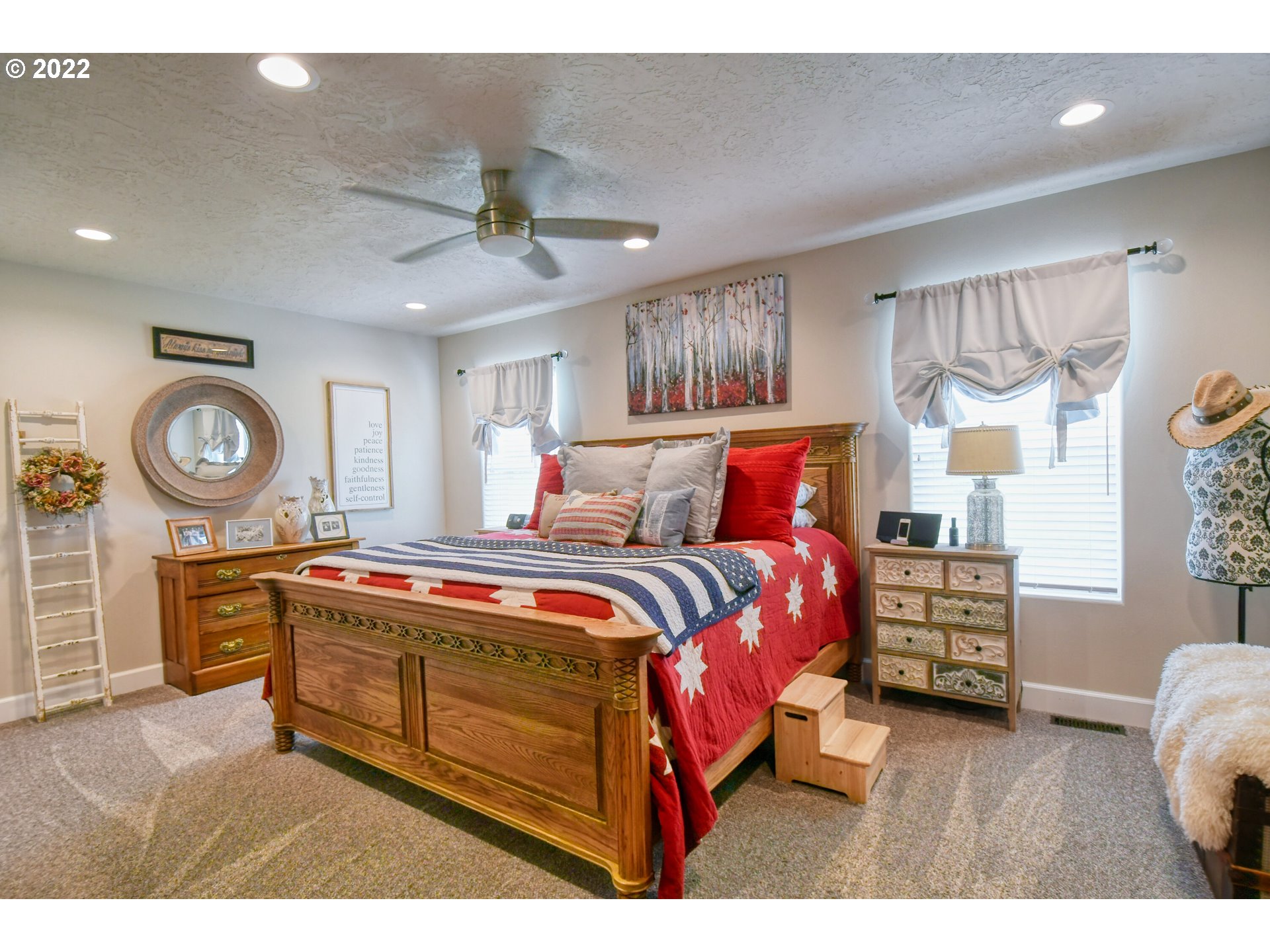 33104 Stage Gulch Road Stanfield, OR 97875 - Photo 12 of 32 a bedroom with a bed a dresser and chair