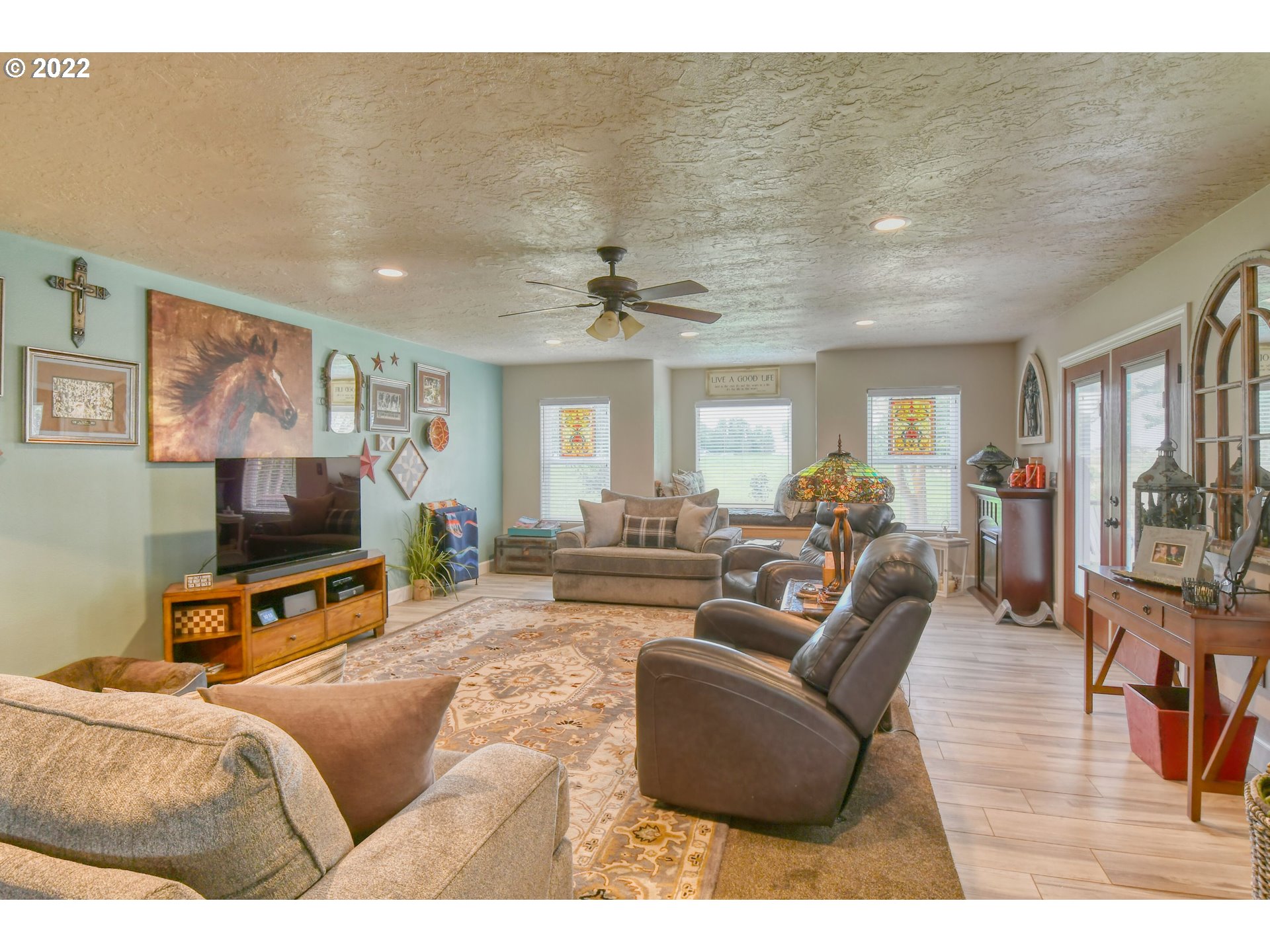 33104 Stage Gulch Road Stanfield, OR 97875 - Photo 4 of 32 a living room with furniture and a flat screen tv
