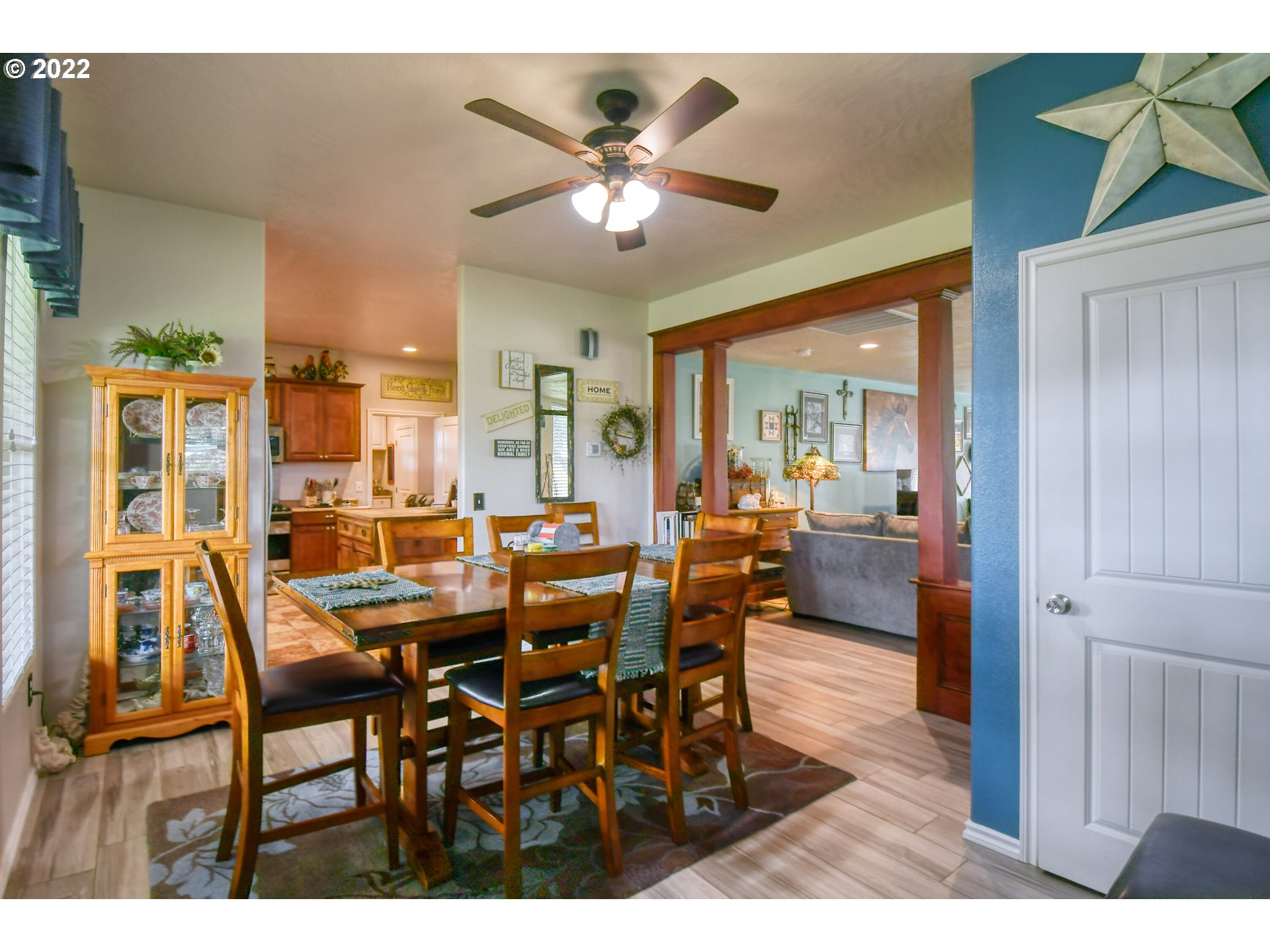 33104 Stage Gulch Road Stanfield, OR 97875 - Photo 7 of 32 a view of a dining room with furniture and a chandelier