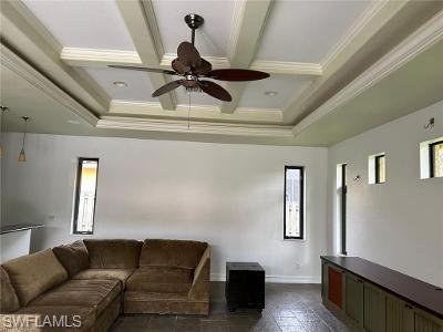 14852 Indigo Lakes Circle Naples, FL 34119 - Photo 7 of 9 a living room with furniture and a window