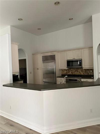 14852 Indigo Lakes Circle Naples, FL 34119 - Photo 8 of 9 a large kitchen with stainless steel appliances a stove a sink and a refrigerator