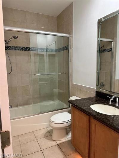 14852 Indigo Lakes Circle Naples, FL 34119 - Photo 9 of 9 a bathroom with a granite countertop sink toilet and shower