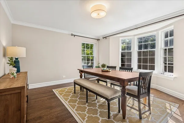 a dining room with a table and chairs