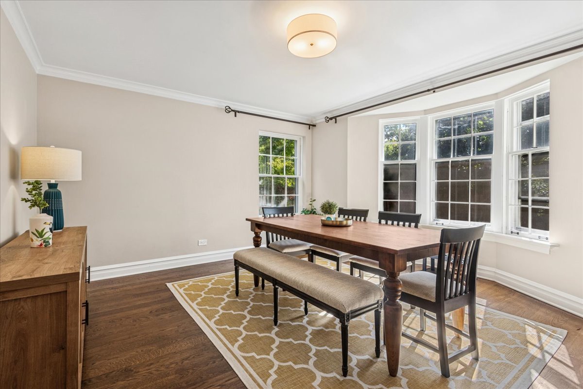 526 Orchard Lane Winnetka, IL 60093 - Photo 8 of 29 a dining room with a table and chairs