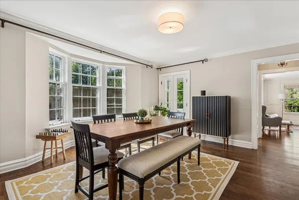 a view of a dining room with furniture and wooden floor