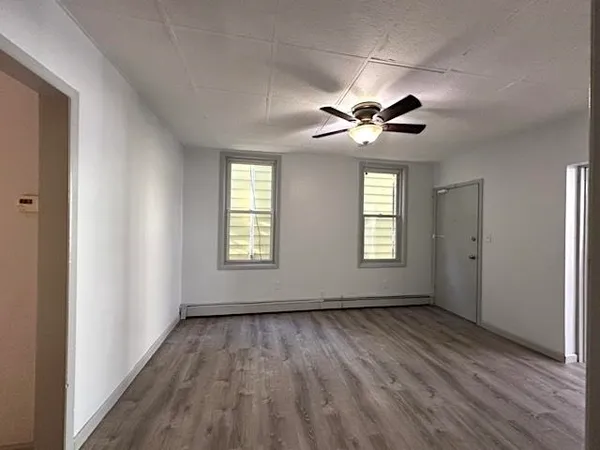 a view of an empty room with a window