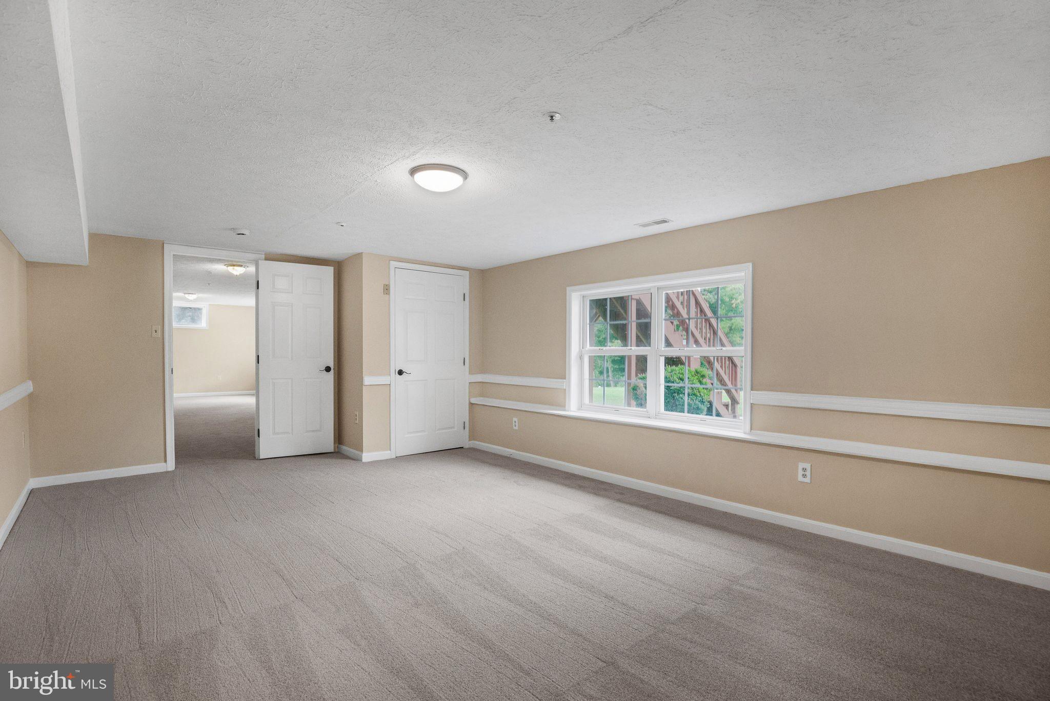 539 Small Reward Road Huntingtown, MD 20639 - Photo 26 of 34 an empty room with windows and closet