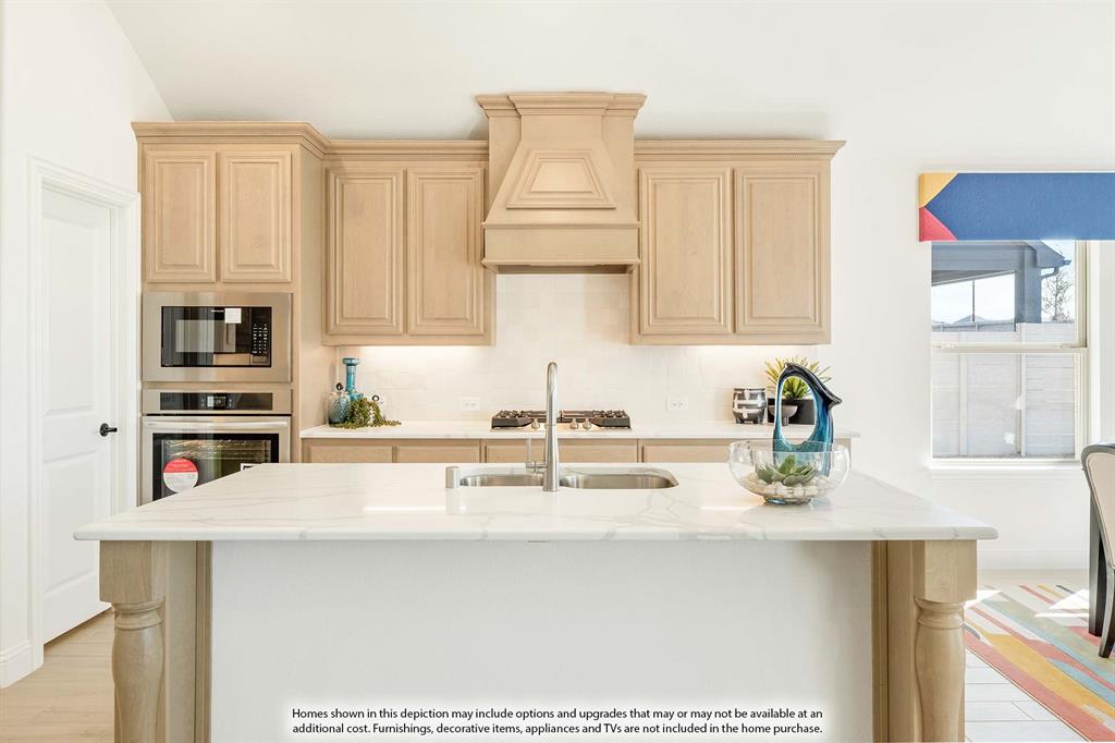 2014 Dundalk Lane Forney, TX 75126 - Photo 11 of 38 a kitchen with kitchen island granite countertop a sink a stove and cabinets