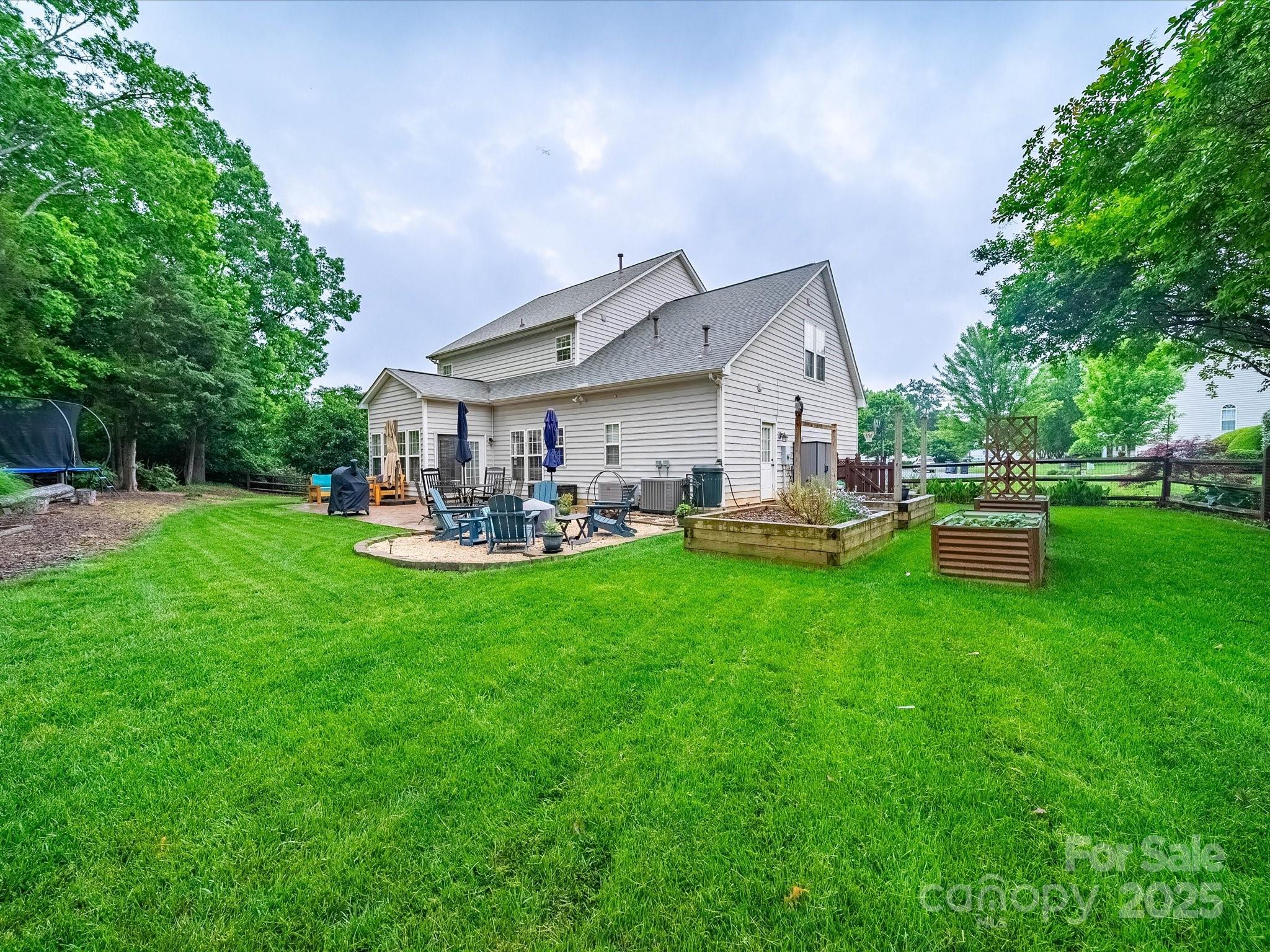 1151 Gower Street Fort Mill, SC 29708 - Photo 2 of 40 a front view of a house with garden and a sitting area