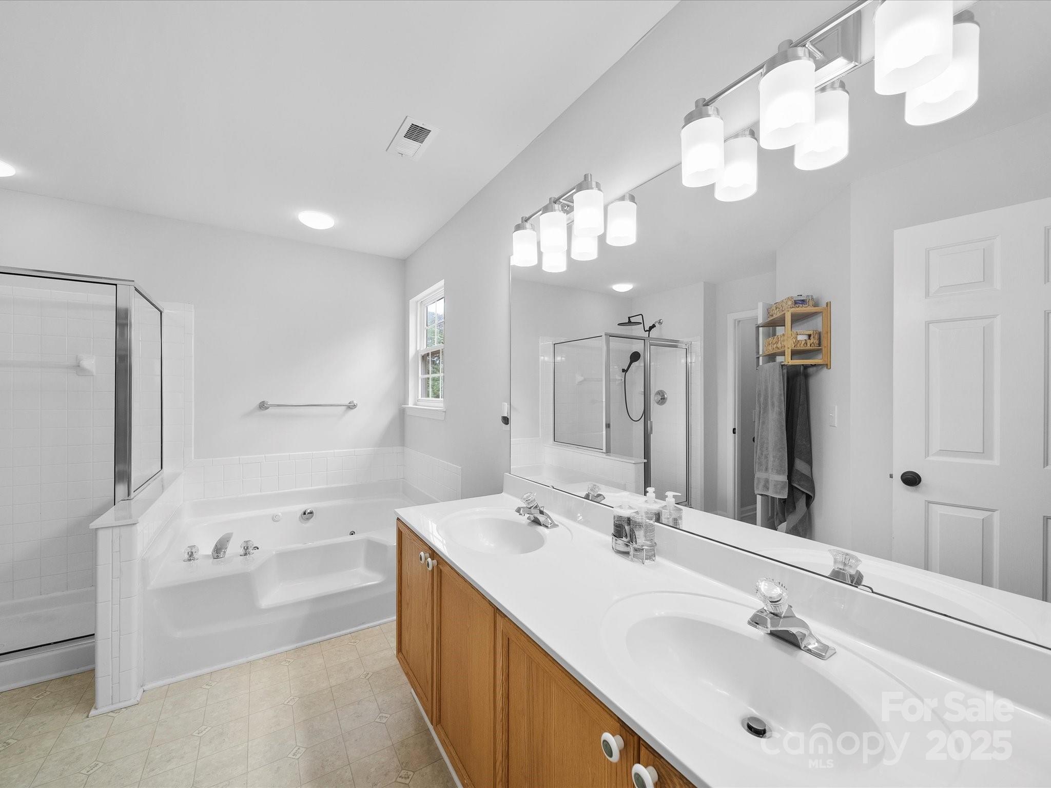 1151 Gower Street Fort Mill, SC 29708 - Photo 22 of 40 a bathroom with a tub sink double and mirror