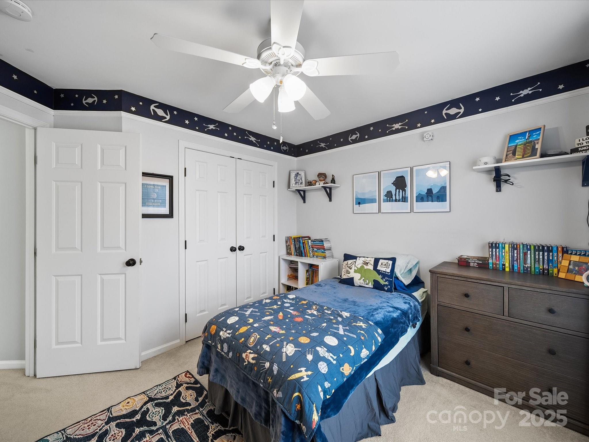 1151 Gower Street Fort Mill, SC 29708 - Photo 25 of 40 a bedroom with a bed and a chandelier