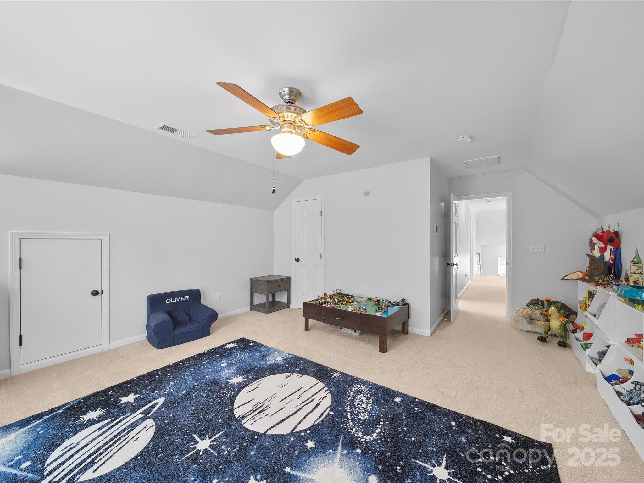 1151 Gower Street Fort Mill, SC 29708 - Photo 28 of 40 a bedroom with a bed and a chandelier