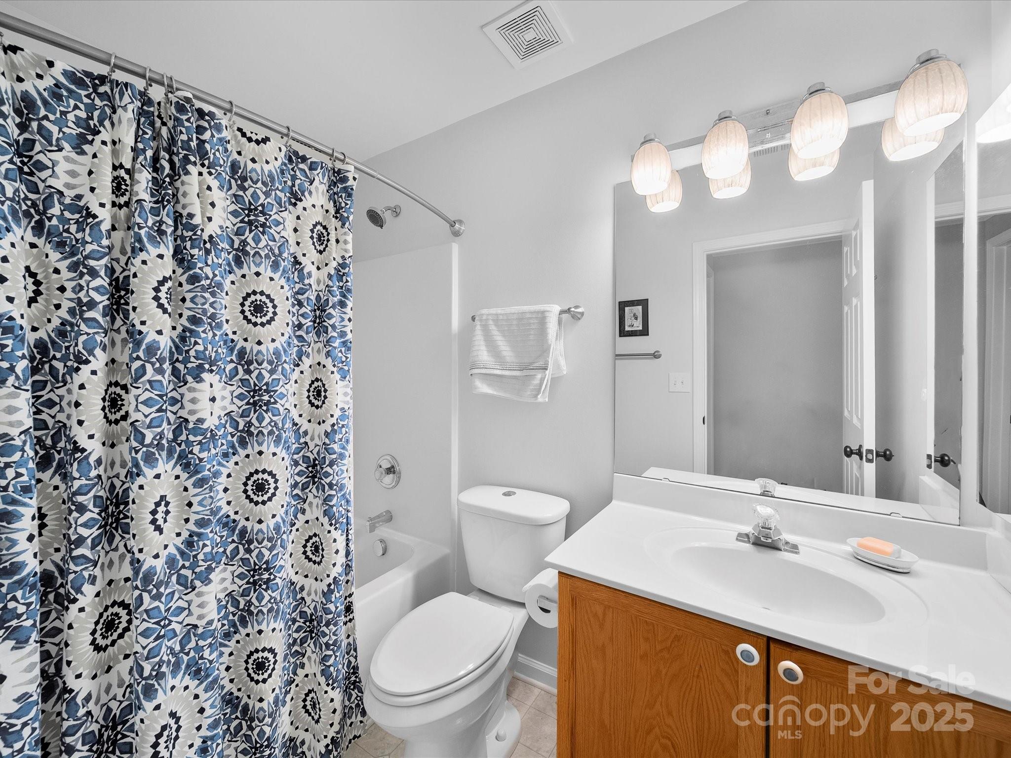 1151 Gower Street Fort Mill, SC 29708 - Photo 29 of 40 a bathroom with a sink a toilet and a mirror