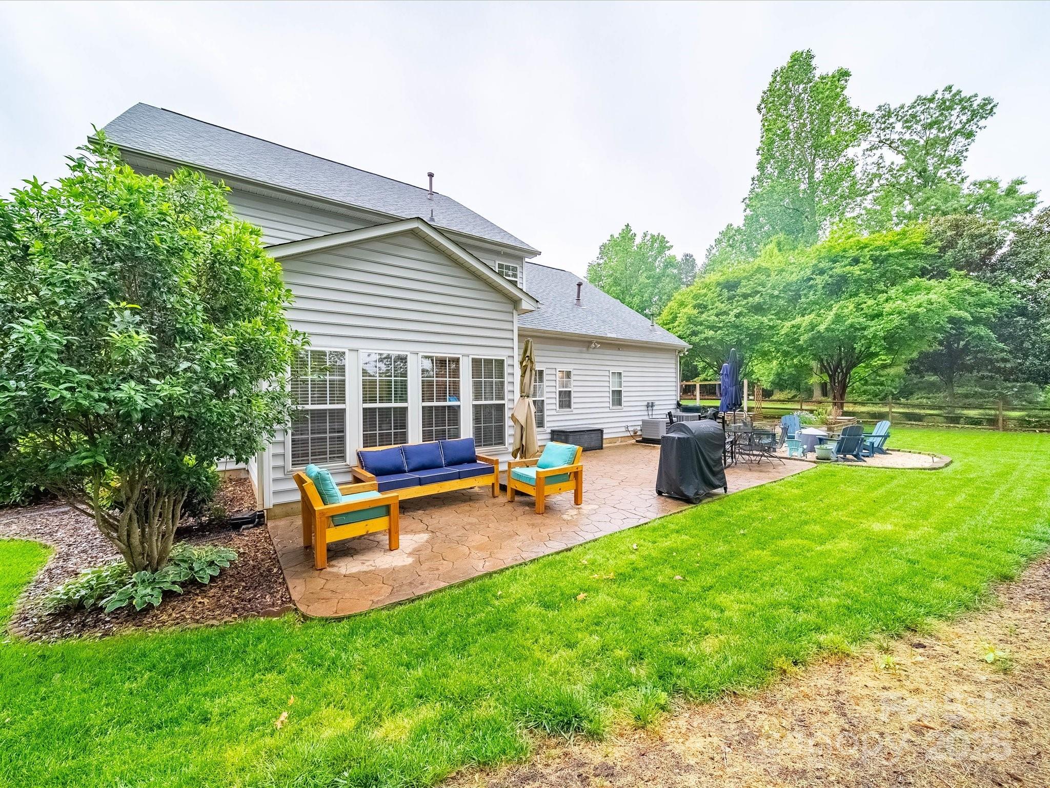 1151 Gower Street Fort Mill, SC 29708 - Photo 35 of 40 a view of a house with a backyard patio and swimming pool