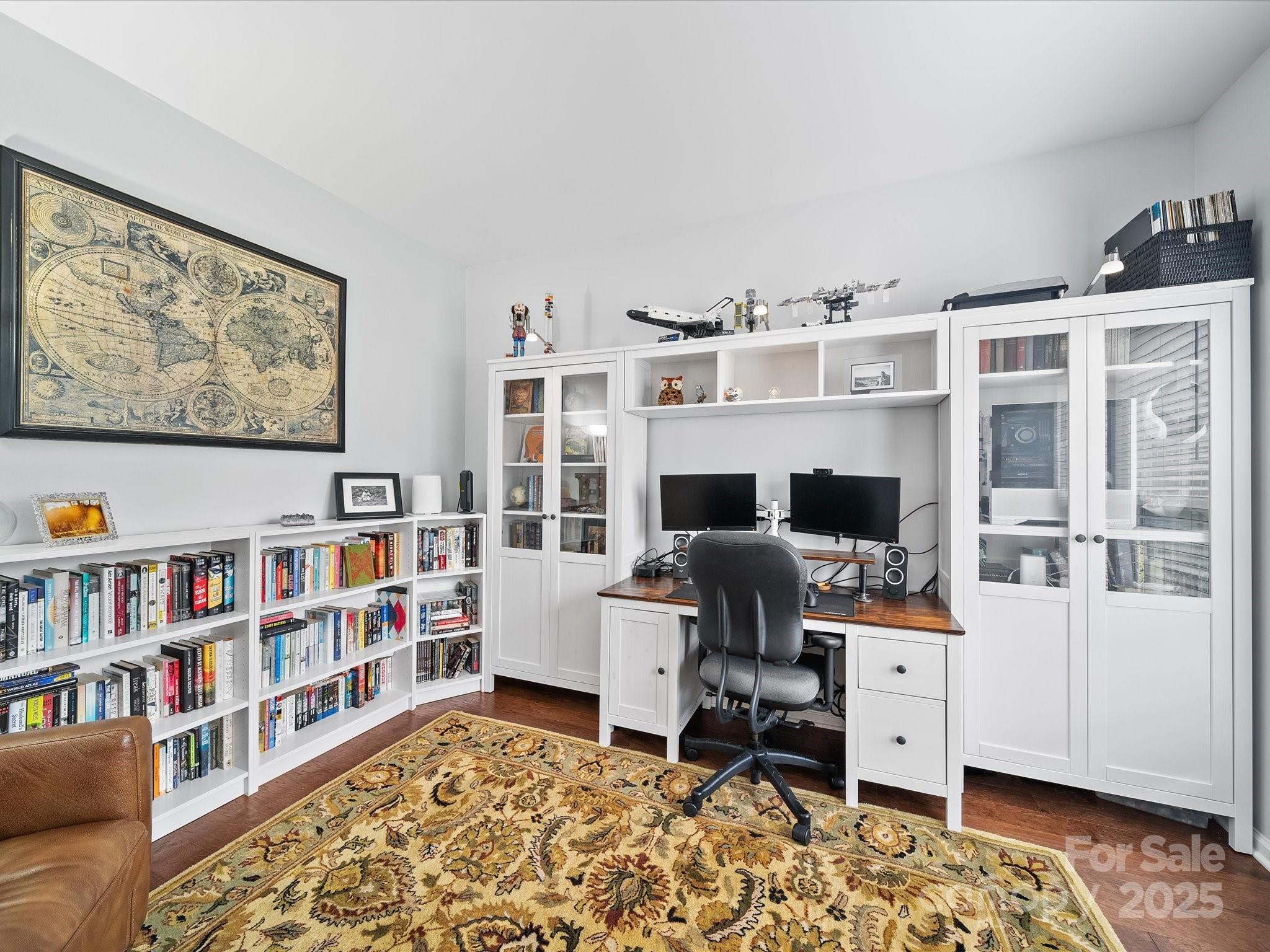 1151 Gower Street Fort Mill, SC 29708 - Photo 5 of 40 a view of a workspace with furniture and book shelf