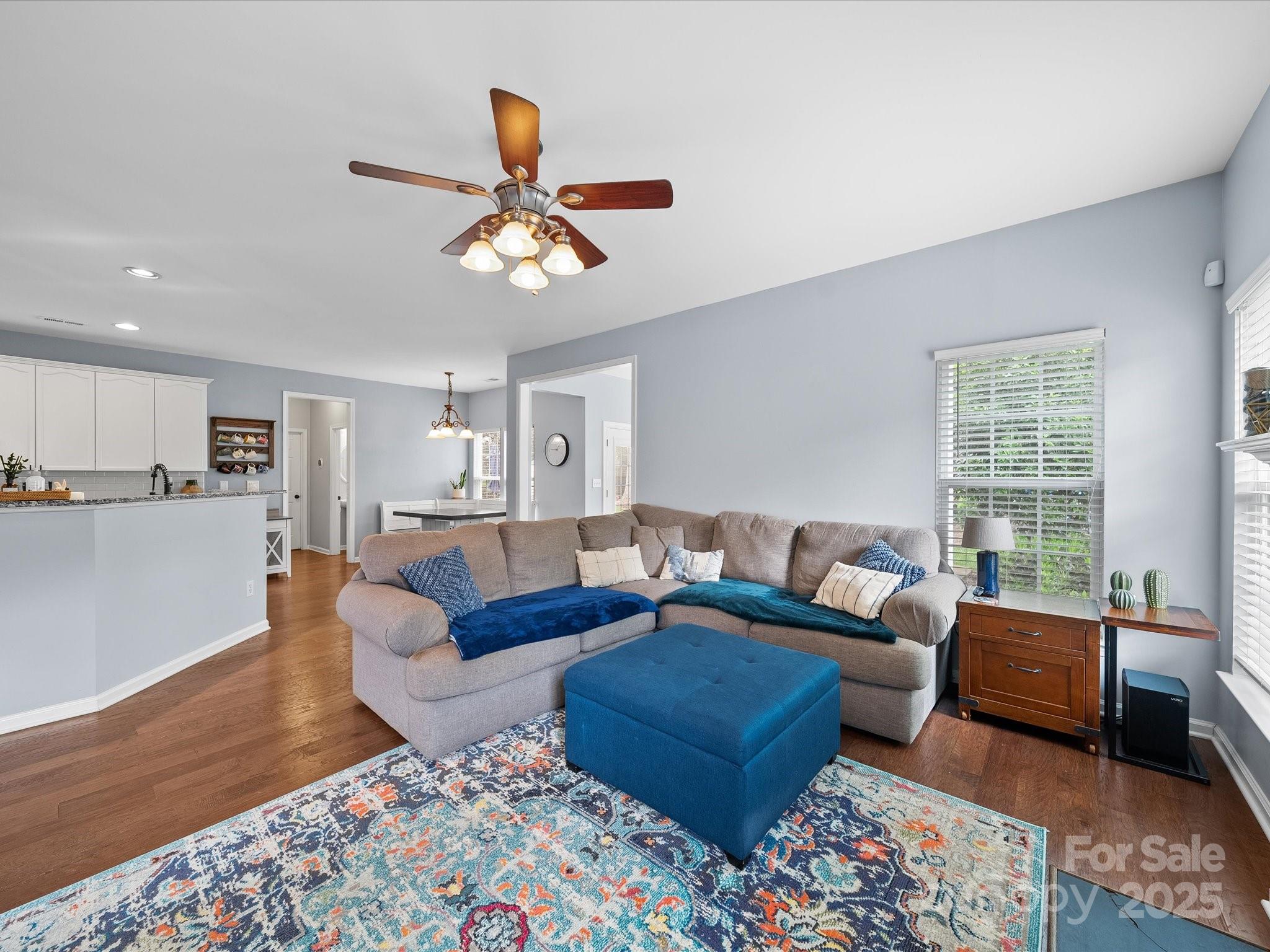 1151 Gower Street Fort Mill, SC 29708 - Photo 9 of 40 a living room with furniture wooden floor and a window