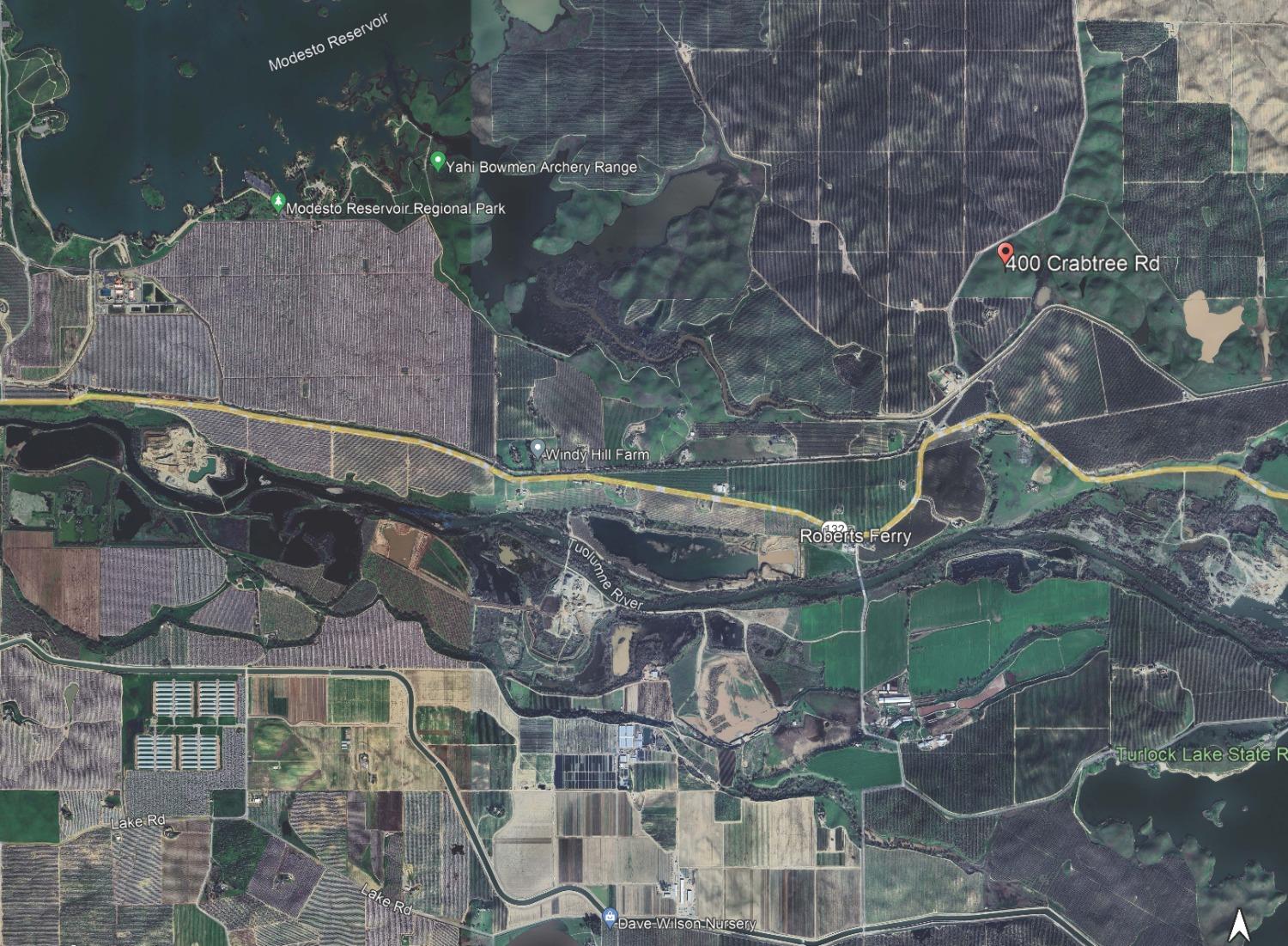 400 Crabtree Road Waterford, CA 95386 - Photo 12 of 13 a backyard of a house with lots of green space and seating