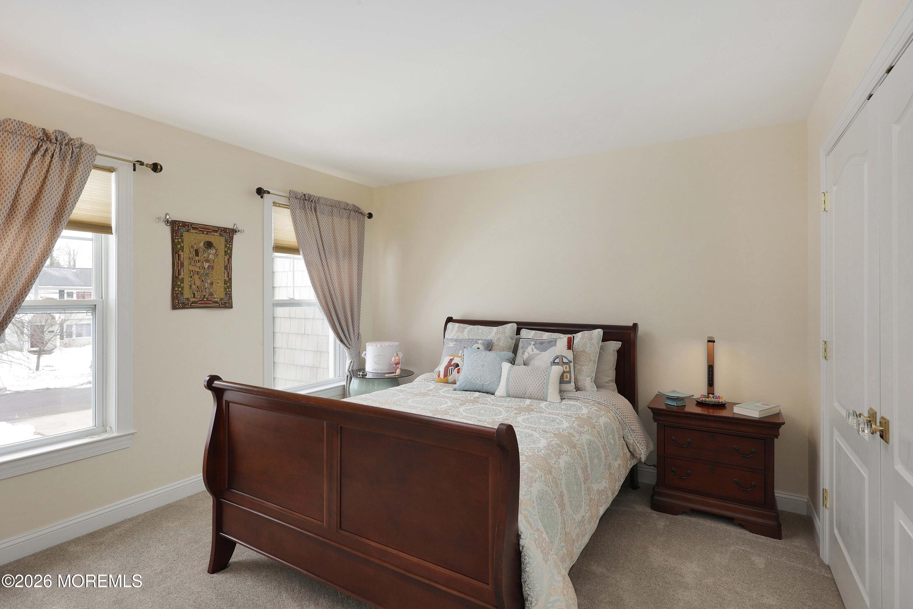 33 Chapin Avenue Red Bank, NJ 07701 - Photo 16 of 33 a bed room with a bed and a window