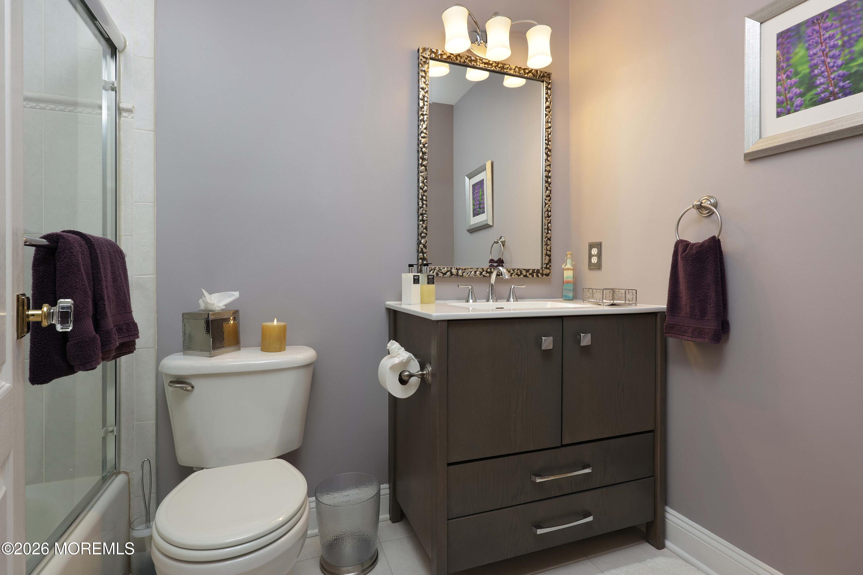 33 Chapin Avenue Red Bank, NJ 07701 - Photo 18 of 33 a bathroom with a toilet a sink and mirror