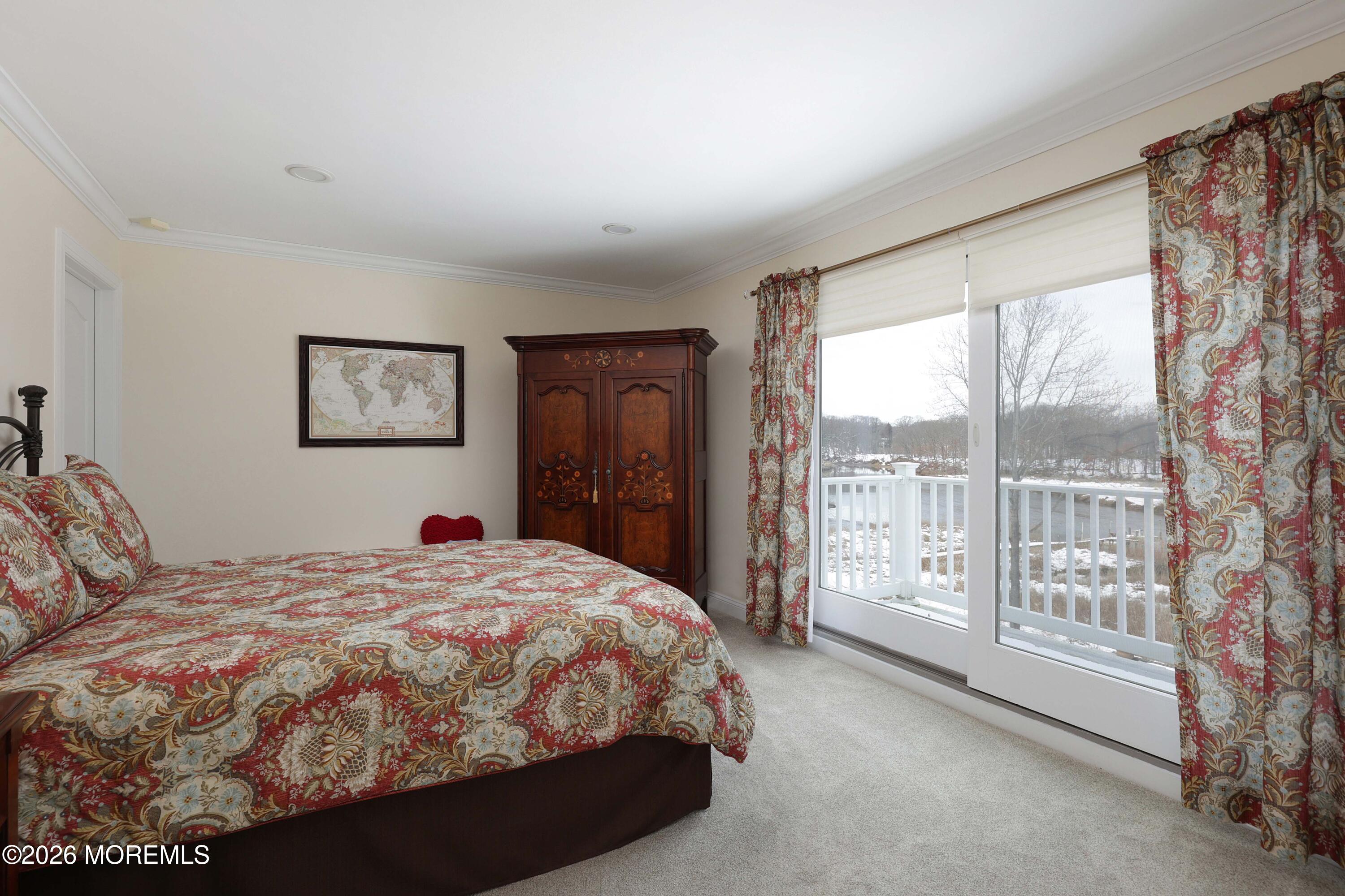 33 Chapin Avenue Red Bank, NJ 07701 - Photo 19 of 33 a spacious bedroom with a bed and a large window