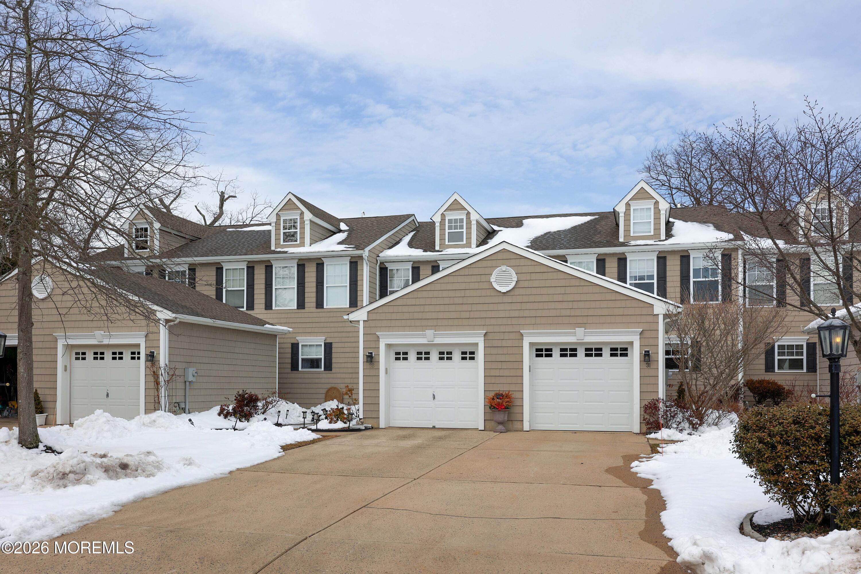 33 Chapin Avenue Red Bank, NJ 07701 - Photo 30 of 33 a view of a white house with a large tree in front of it