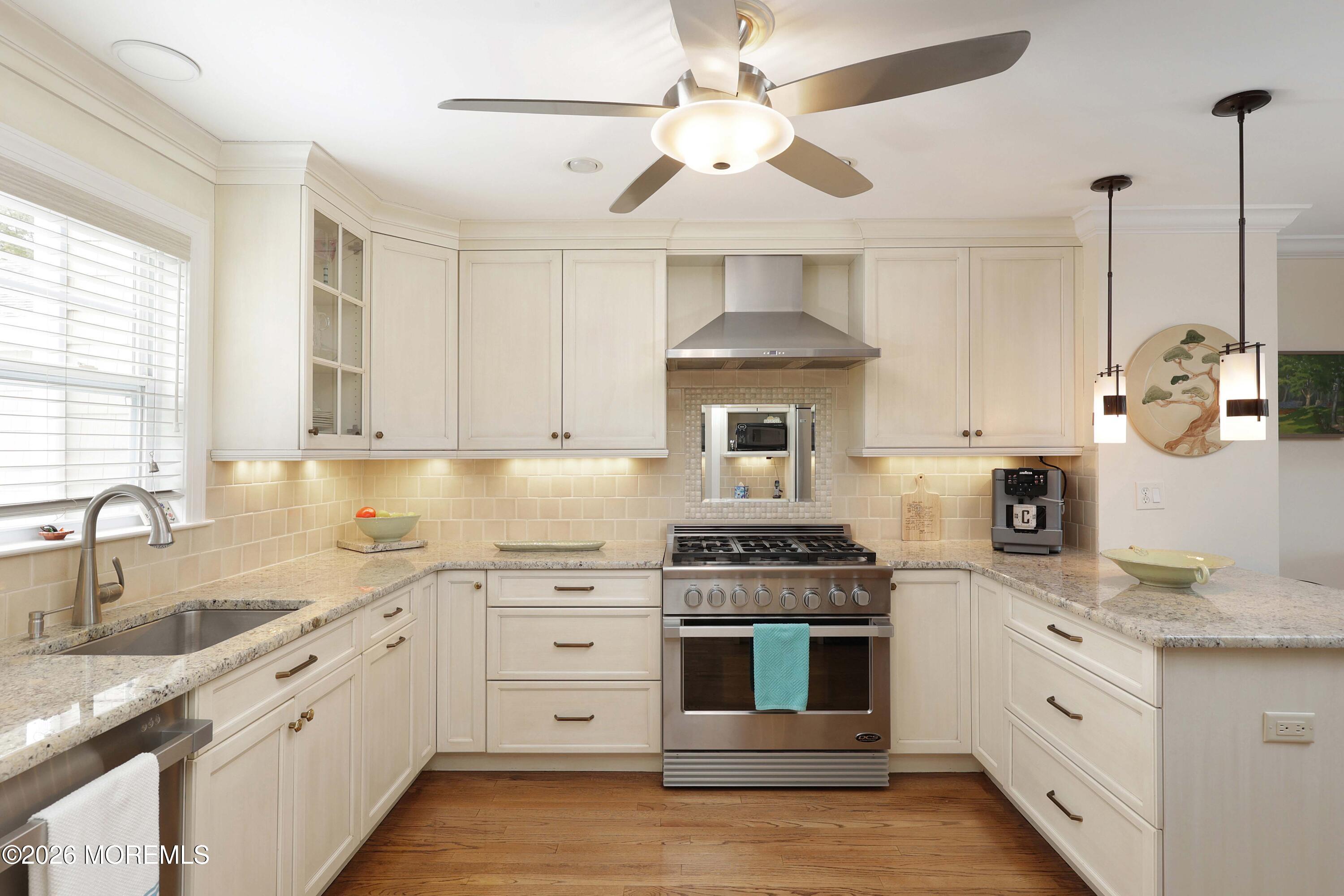 33 Chapin Avenue Red Bank, NJ 07701 - Photo 4 of 33 a kitchen with stainless steel appliances granite countertop a sink stove and refrigerator