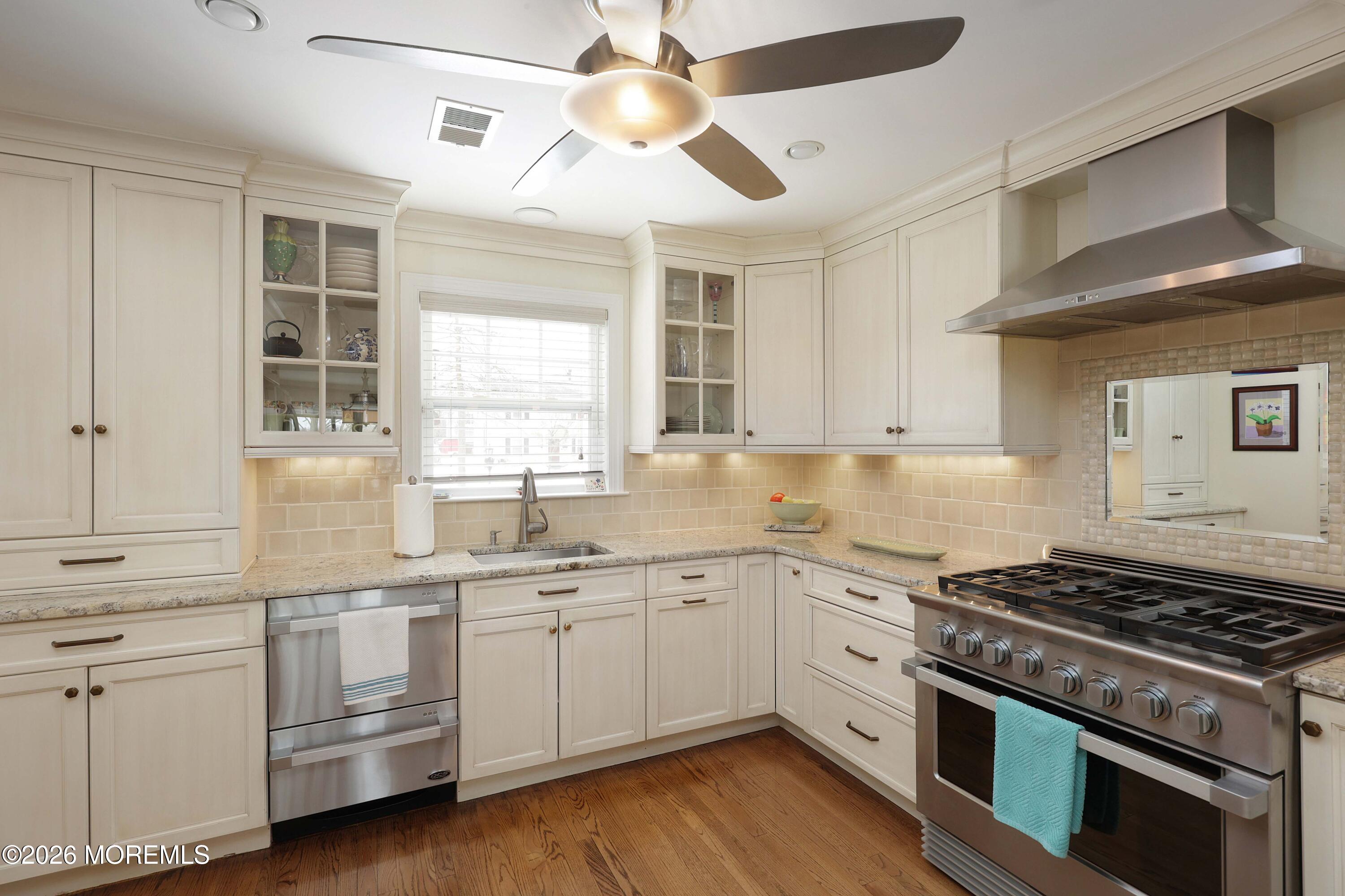33 Chapin Avenue Red Bank, NJ 07701 - Photo 5 of 33 a kitchen with white cabinets and white appliances