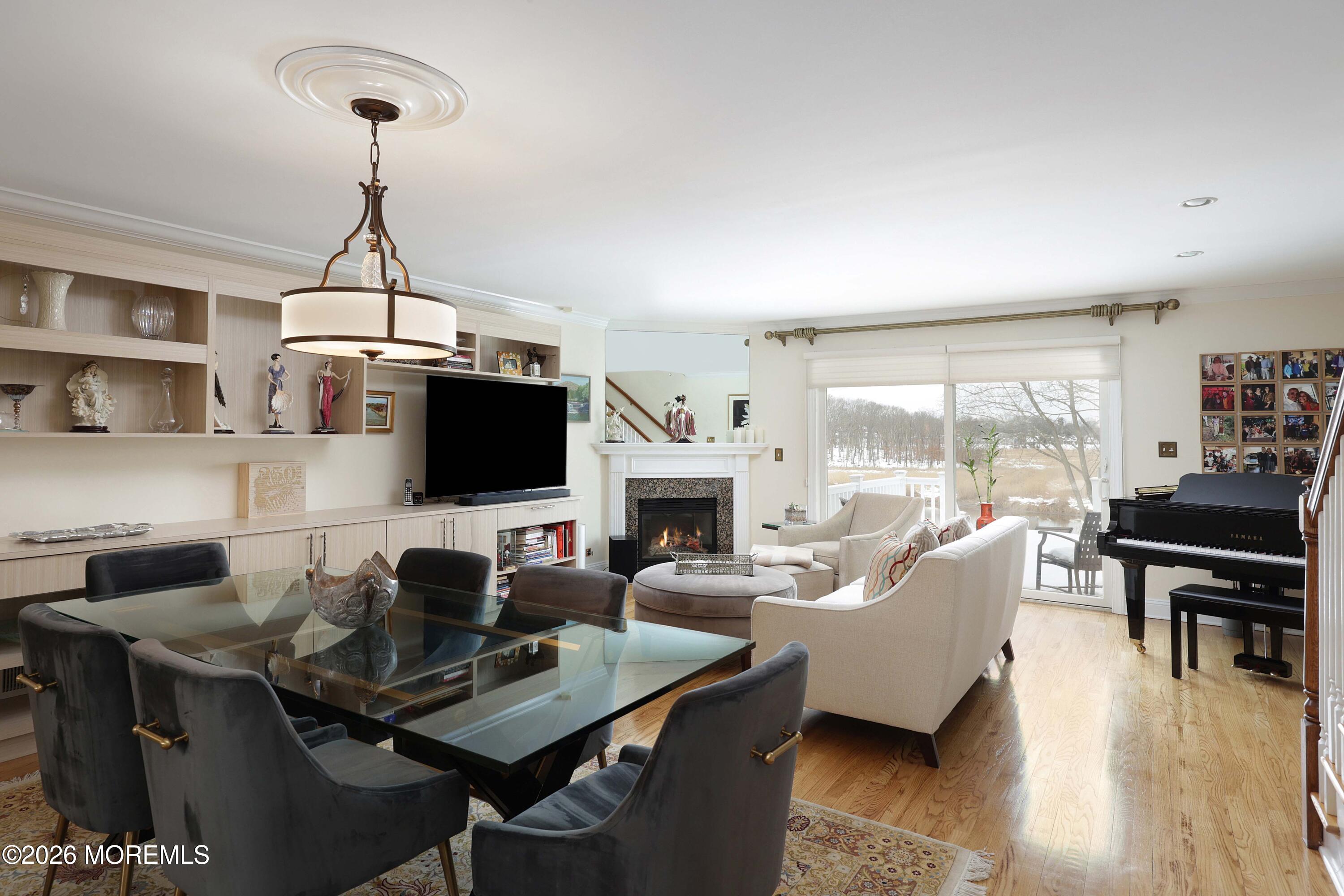 33 Chapin Avenue Red Bank, NJ 07701 - Photo 9 of 33 a living room with furniture a fireplace and a flat screen tv