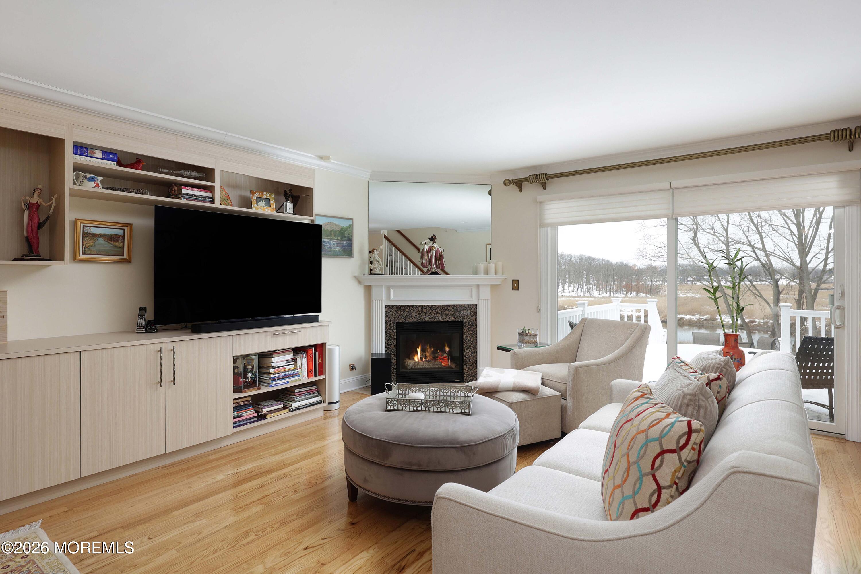 33 Chapin Avenue Red Bank, NJ 07701 - Photo 10 of 33 a living room with furniture a flat screen tv and a fireplace