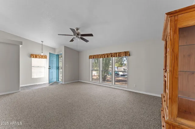 a view of an empty room with a window