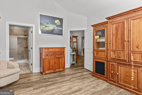 a view of a livingroom with furniture and cabinet