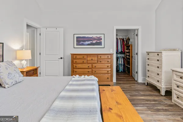 a bedroom with a bed and closet