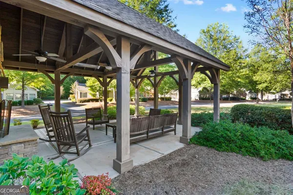 a view of outdoor space with chairs and garden