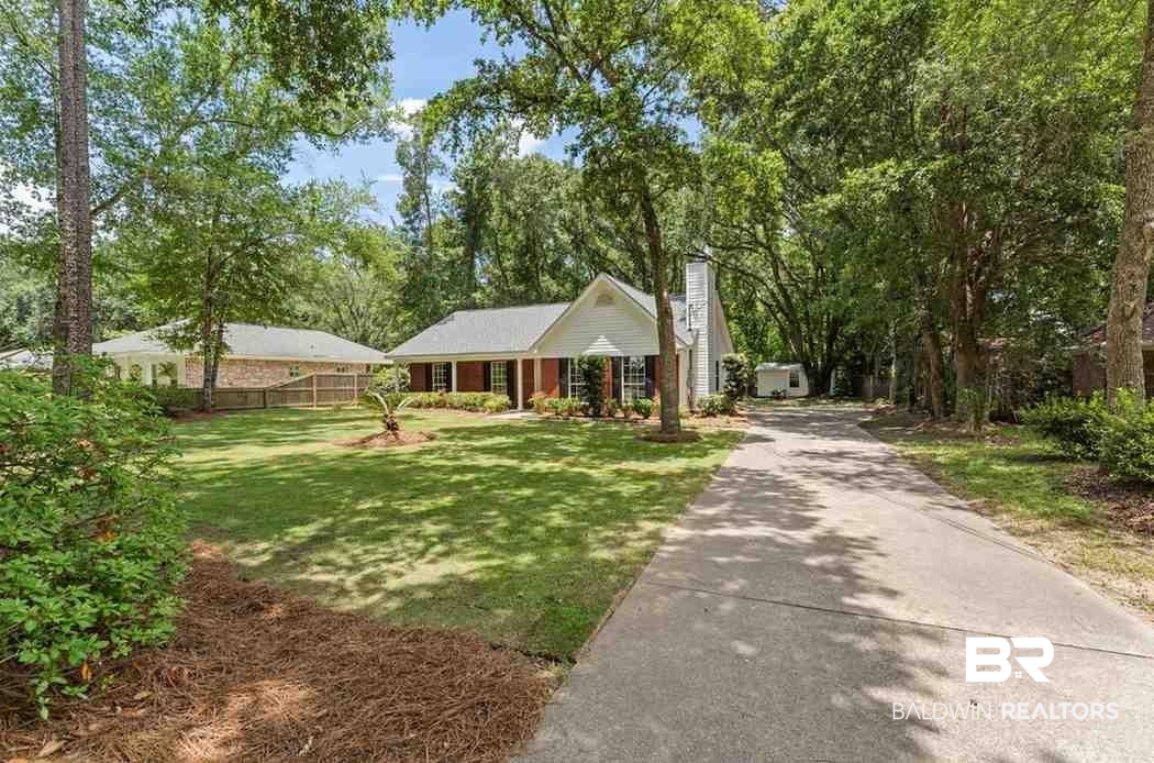 10251 Windmill Road Fairhope, AL 36532 - Photo 3 of 44 View of front facade with a chimney and asphalt driveway