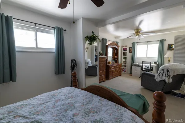 a bedroom with furniture and a window