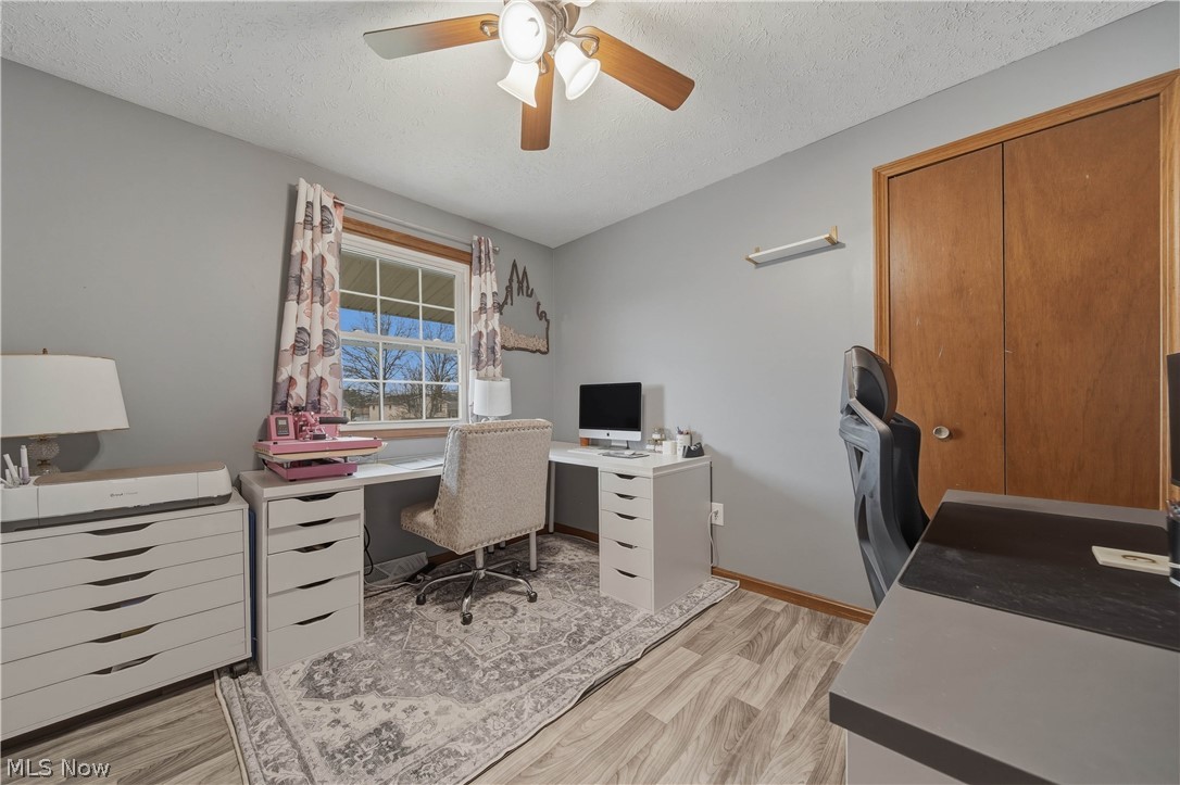 702 Perry Drive Northwest Canton, OH 44708 - Photo 25 of 46 Office space featuring a ceiling fan, and a textured ceiling
