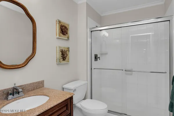 a living room with fireplace furniture and a potted plant
