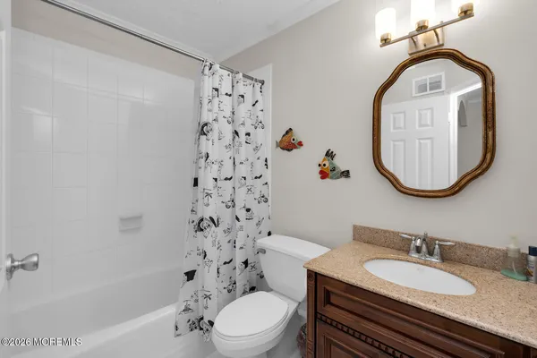 a kitchen with stainless steel appliances granite countertop a sink a stove and refrigerator