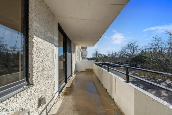 a bedroom with a bed and a lamp