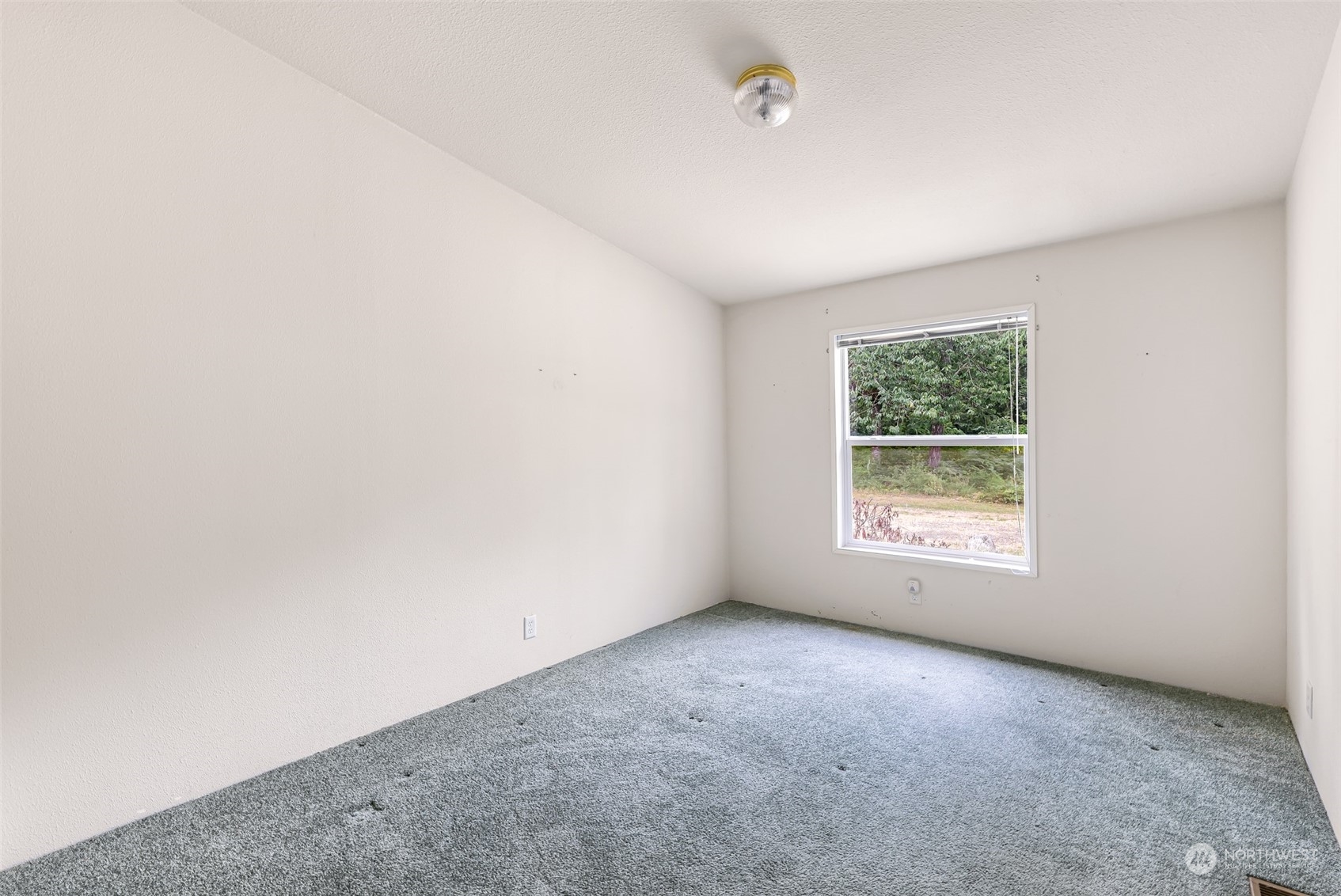 5870 Mission Road Bellingham, WA 98226 - Photo 28 of 40 an empty room with a window