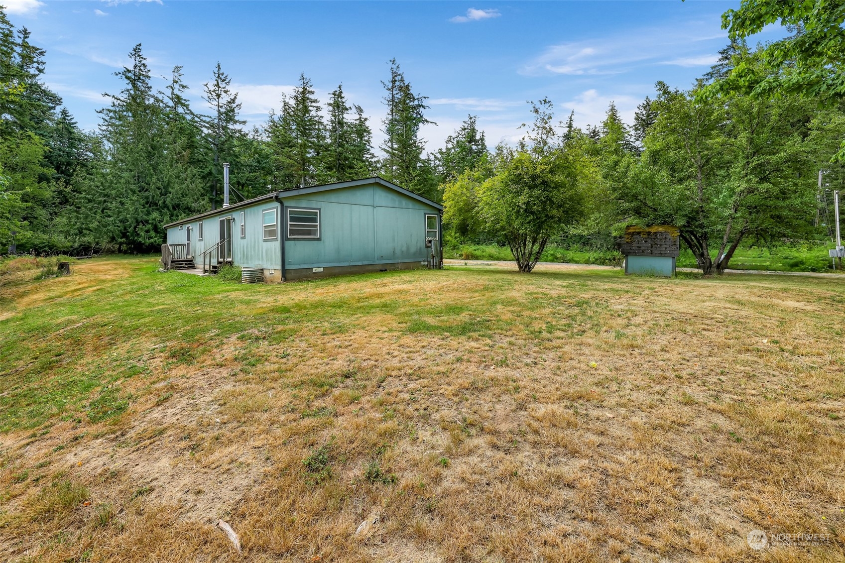 5870 Mission Road Bellingham, WA 98226 - Photo 35 of 40 a house with trees in the background